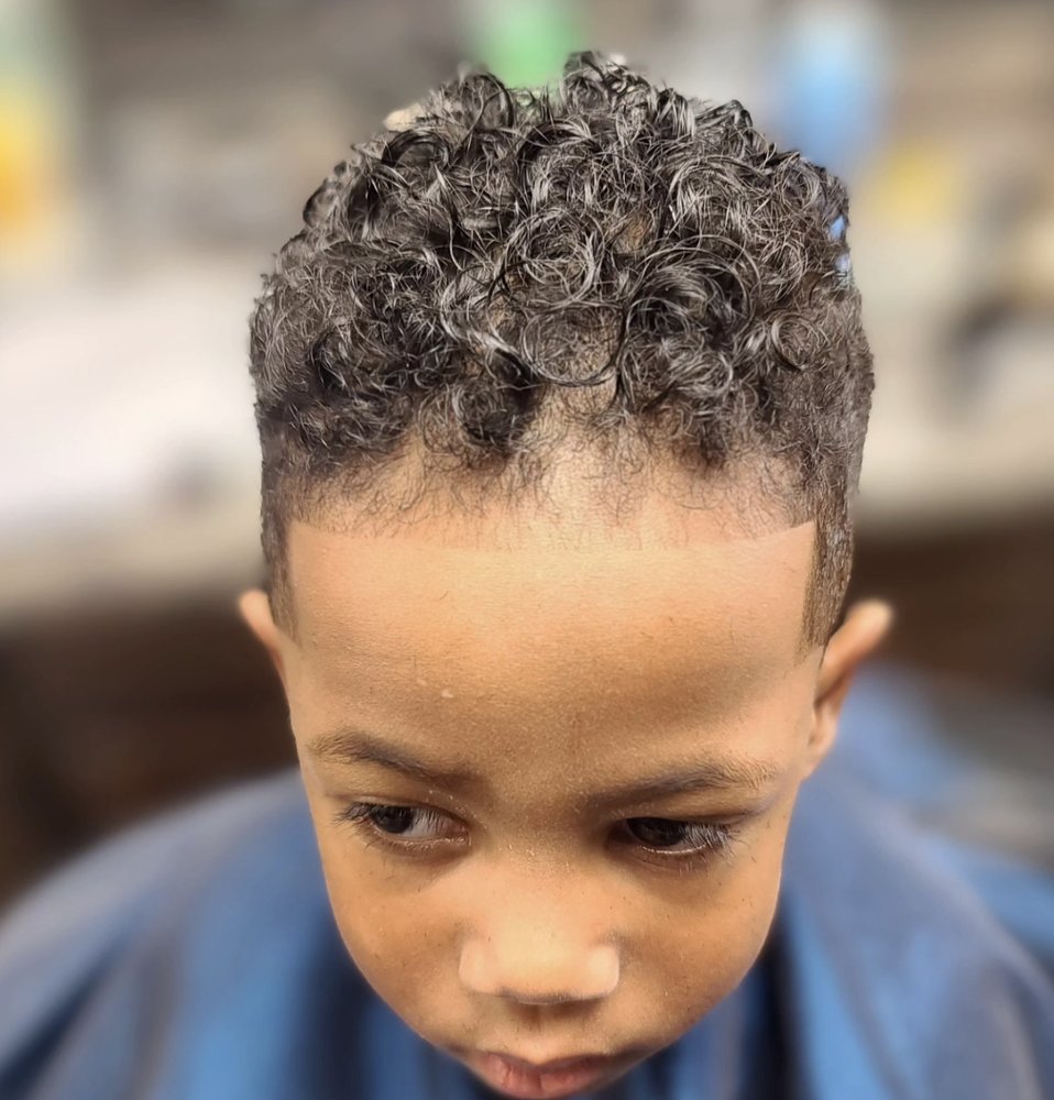 Curly top shaped at Grey's Barbershop